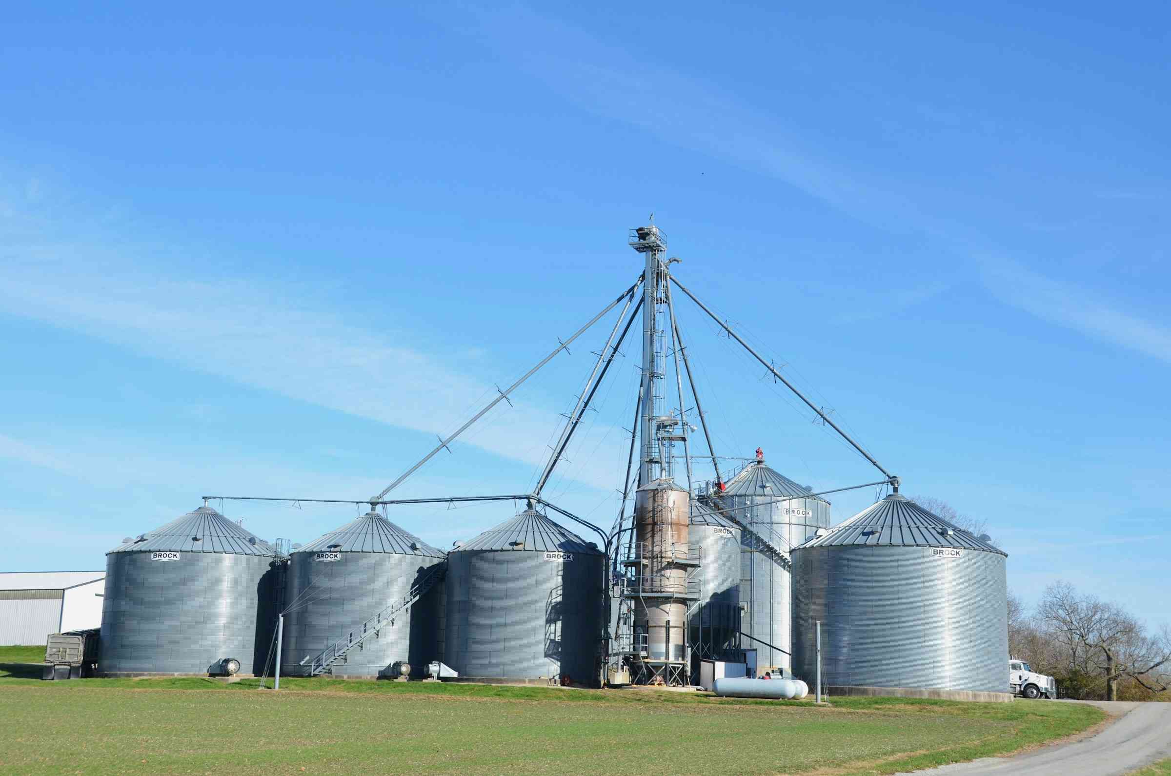 Grain bins and an elevator leg at a farm